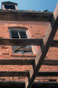 Bricks and rafters on an old mill, near sunset